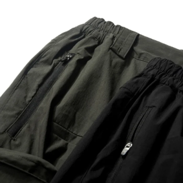 Cargo pants wide side pockets hidden pocket ykk zippers pupil travel techwear futuristic streetwear aesthetic 3